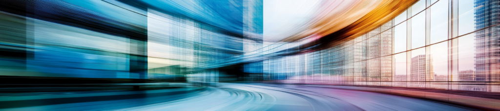 Blurred motion of train near office building.