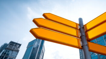 Blank street signs pointing in multiple directions.