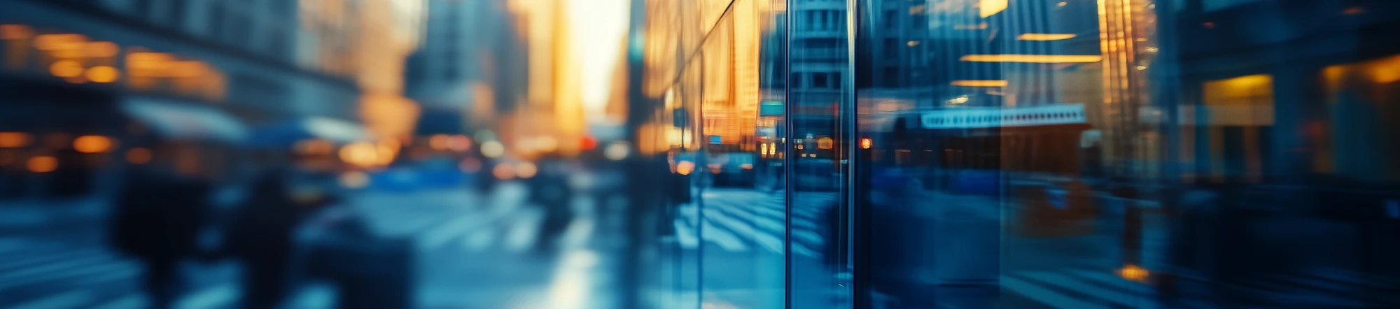 Blurry image of people rushing around corporate building